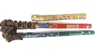 Two didgeridoos and a rain shaker.