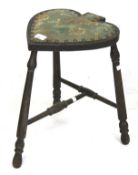 An oak Victorian three legged stool club shaped seat.