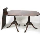 A regency style mahogany twin pedestal dining table.