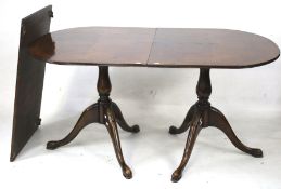 A regency style mahogany twin pedestal dining table.