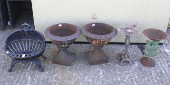 A pair of vintage metal garden urns, two bird baths and a fire basket grate. Max.