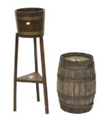 A vintage barrel and a raised plant stand modelled from a barrel.