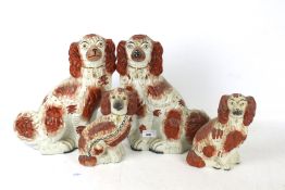 A pair of large Staffordshire pottery spaniel dogs and two others. Max.