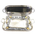 Four silver plated serving trays. Of rectangular form, three with twin handles, Max.