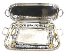 Four silver plated serving trays. Of rectangular form, three with twin handles, Max.