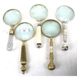 Five assorted contemporary magnifying glasses. All with different handles, max.