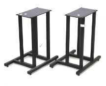 A pair of metal floor speaker stands.