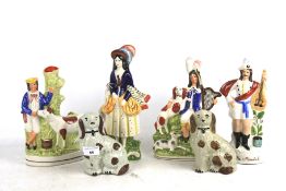 Four Staffordshire flatback figures and a pair of dogs. Max.