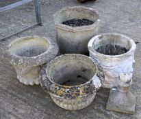 Four stone garden plant pots. Two round, one octagonal with a base. Max.