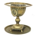 A brass jardiniere and circular tray.