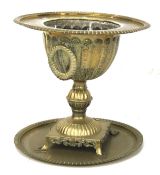 A brass jardiniere and circular tray.