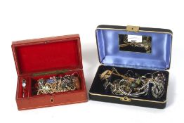 Two jewellery boxes containing an assortment of costume jewellery.