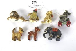 Eight Stieff metal animal figures. Including a rabbit, penguin, dog, etc.