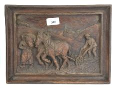 A carved wooden tray. Featuring a horse ploughing a field, 31.5cm x 23.