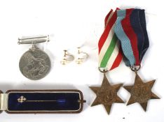 Three WWII medals, a pair of 9ct earrings and yellow metal pin.