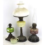 Four Victorian and later oil lamps.