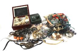 An assortment of jewellery. Including necklaces, beads, bangles, bracelets, etc.