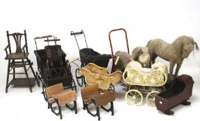 An assortment of vintage childrens' toys. Including prams, push-along animals, dolls furniture, etc.
