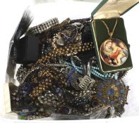 An assortment of costume jewellery. Including necklaces, bracelets, beads, etc.