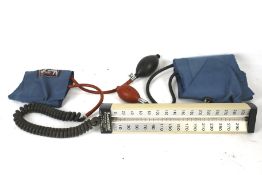 A vintage Baumanometer blood pressure gauge. Complete with cuffs, etc.