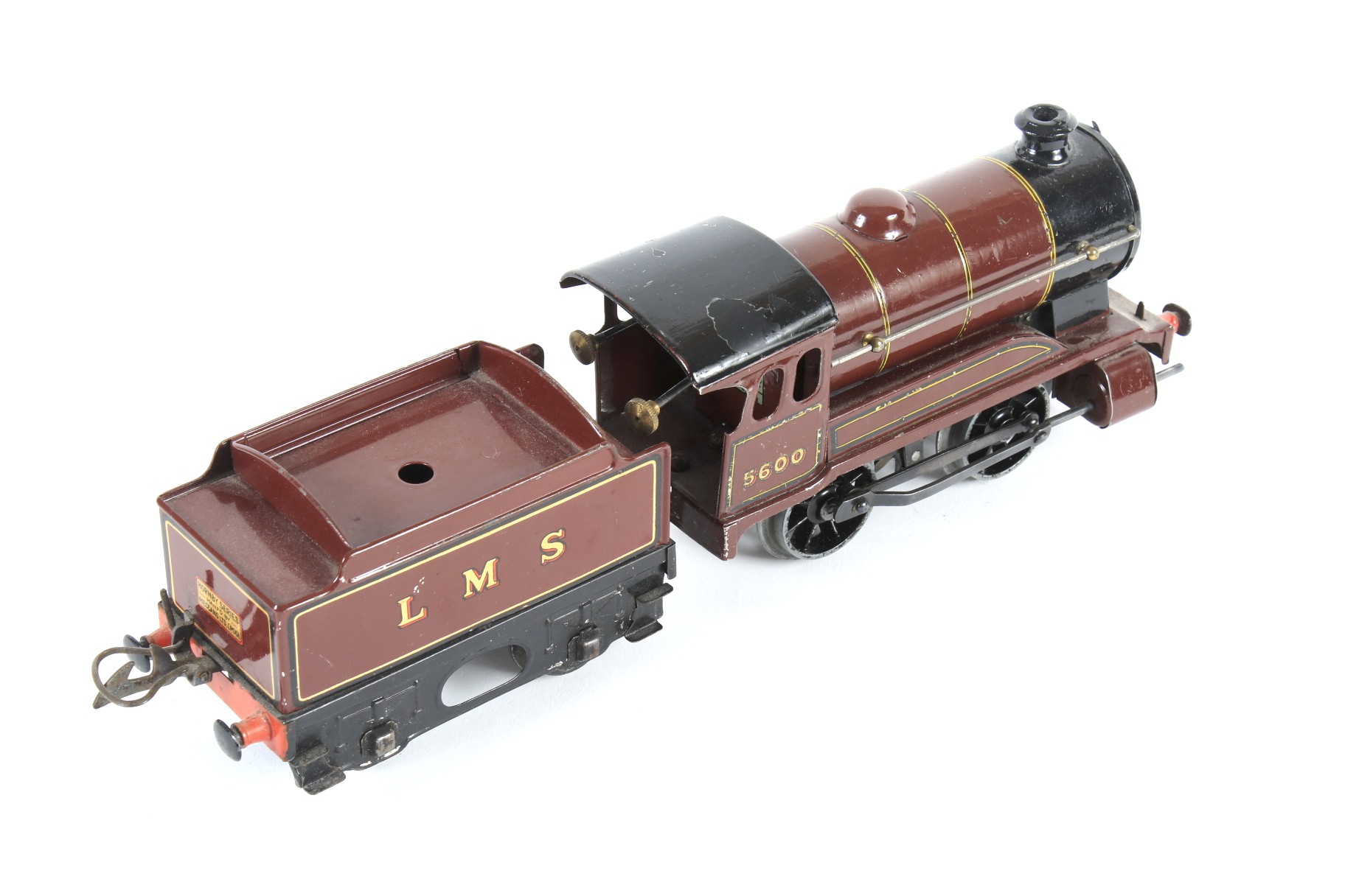 A Hornby O gauge tinplate clockwork locomotive and tender. 0-4-0, LMS livery no. 5600. - Image 2 of 2