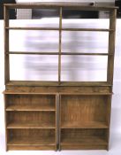Three contemporary stained pine open book shelves.