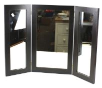 A three section dressing table mirror. With black wooden frame.