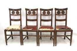 A set of four 19th century oak dining chairs.