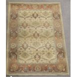 A 20th century beige rug.