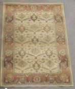 A 20th century beige rug.