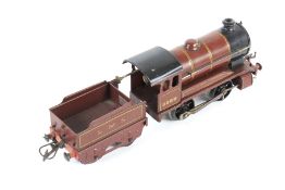 A Hornby O gauge tinplate clockwork locomotive and tender. 0-4-0, LMS livery no. 5600.