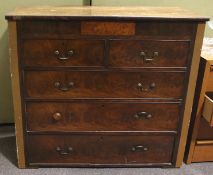 A mahogany chest of two small over three long drawers with secret drawer.