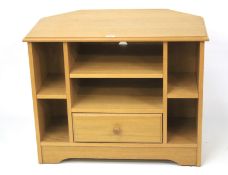 A contemporary pine TV cabinet. The cent