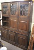 A stained oak display cabinet. Comprisin