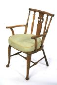 A 20th century oak framed armchair. With