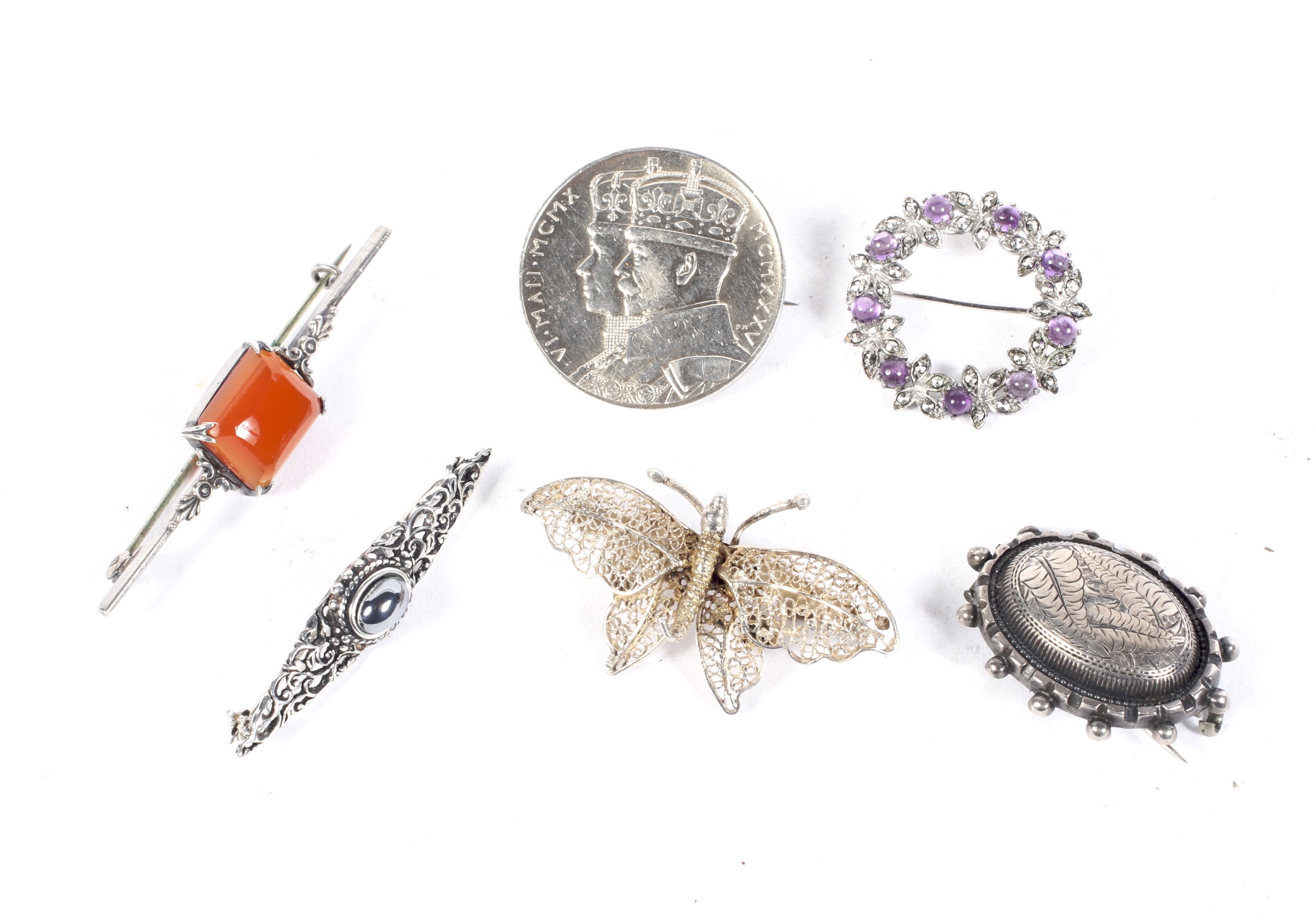 Six ladies silver and white metal brooch