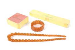 An opaque amber graduated oval bead neck