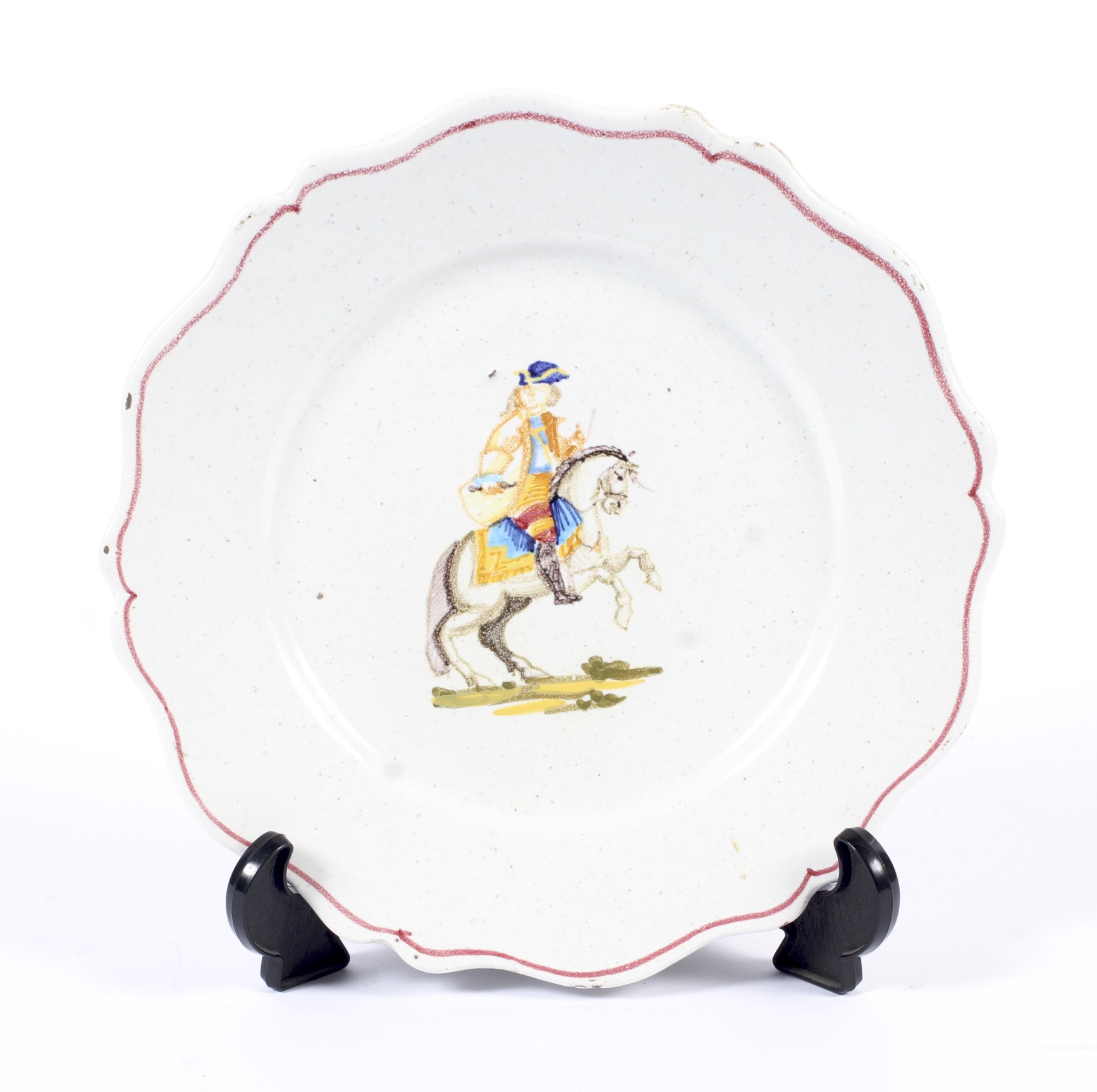 A Continental faience plate painted with