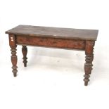A Victorian stained oak plank top table.