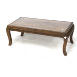 A contemporary wooden coffee table. Of r