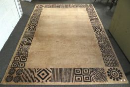 A contemporary rug. Tan coloured ground