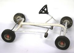 A vintage toy pedal car. Painted blue, L