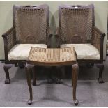 Two Edwardian Bergere armchairs and a si
