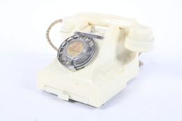 A GPO 4402 Cream Bakelite telephone with drawer to base and stamped '312f. H54/3a' under.