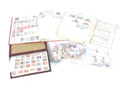 A world collection of stamps in two albums and several loose pages