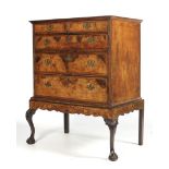 A Queen Anne walnut chest on stand fitted two short over three long graduated drawers ( 4 with