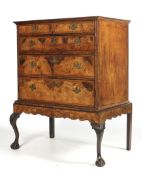 A Queen Anne walnut chest on stand fitted two short over three long graduated drawers ( 4 with