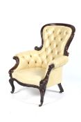 A Victorian Mahogany Library / Armchair with cream leather button back upholstery and brass stud