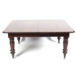 A Victorian mahogany D-end extending dining table.