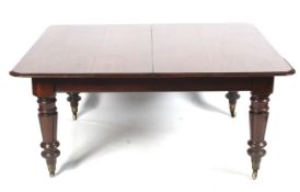 A Victorian mahogany D-end extending dining table.